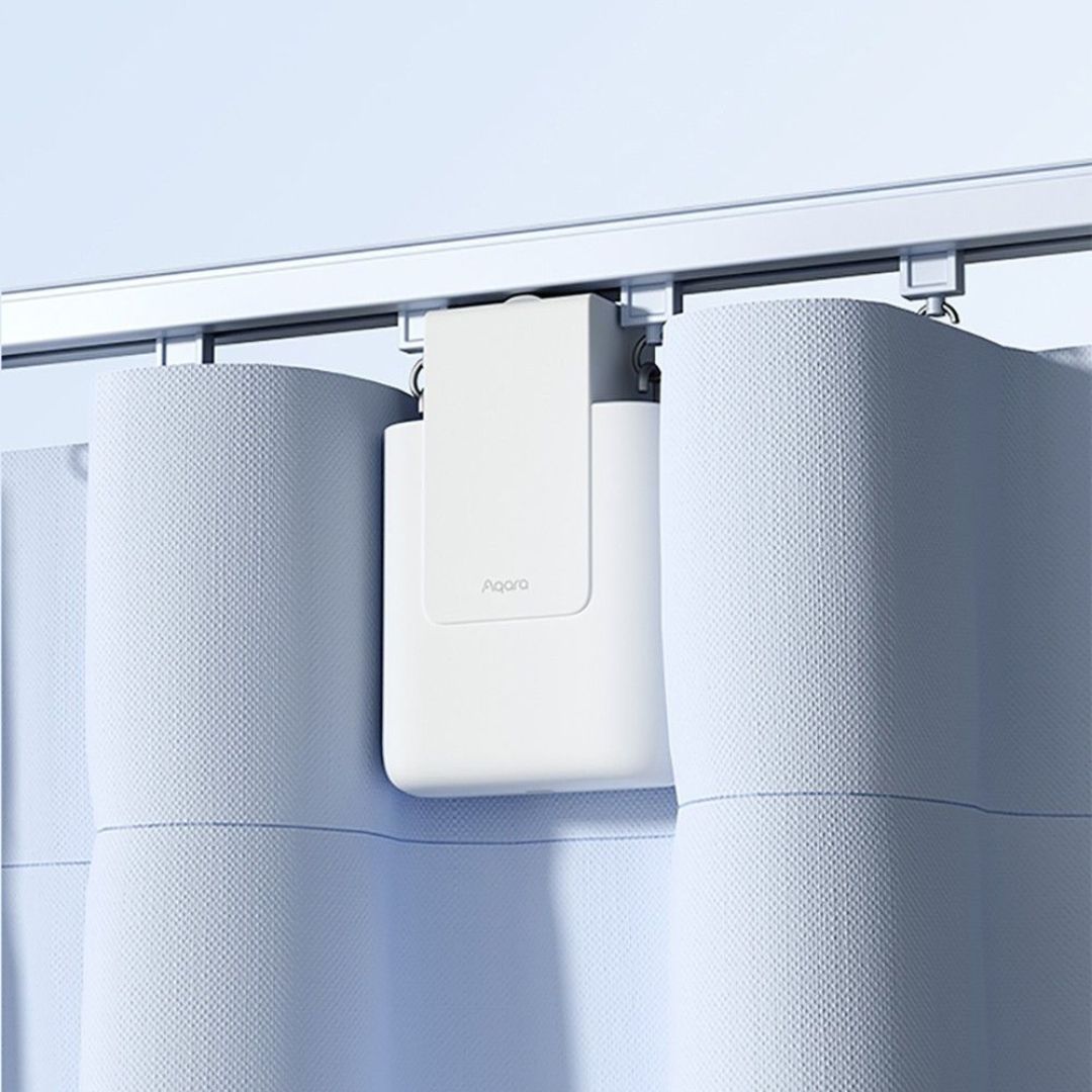 O Motor Inteligente para Cortinas E1 da Aqara oferece controlo remoto, suporta cortinas até 12kg, automação personalizável para uma casa inteligente e elegante.